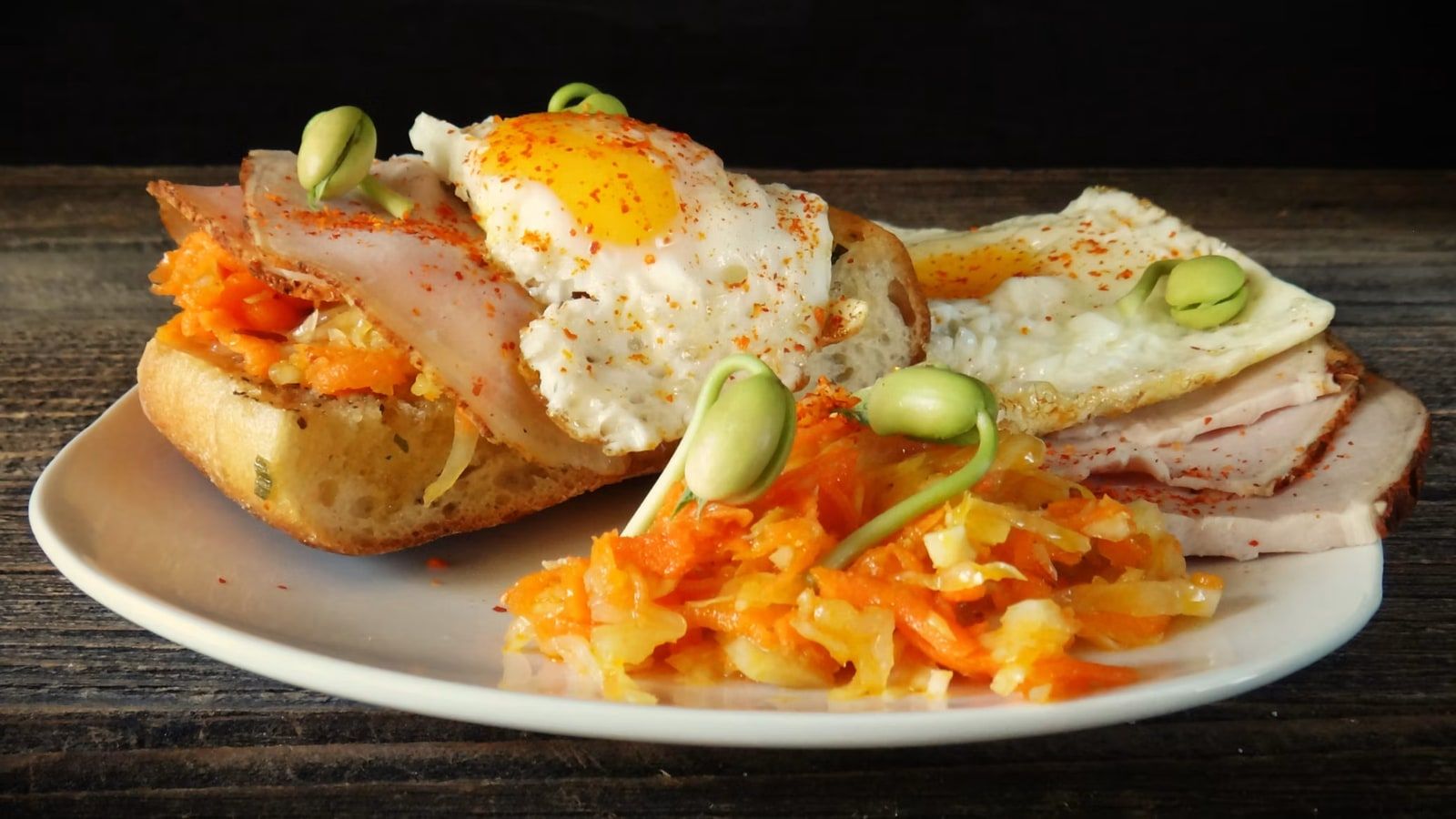 Open-faced country ham topped with a fried egg.